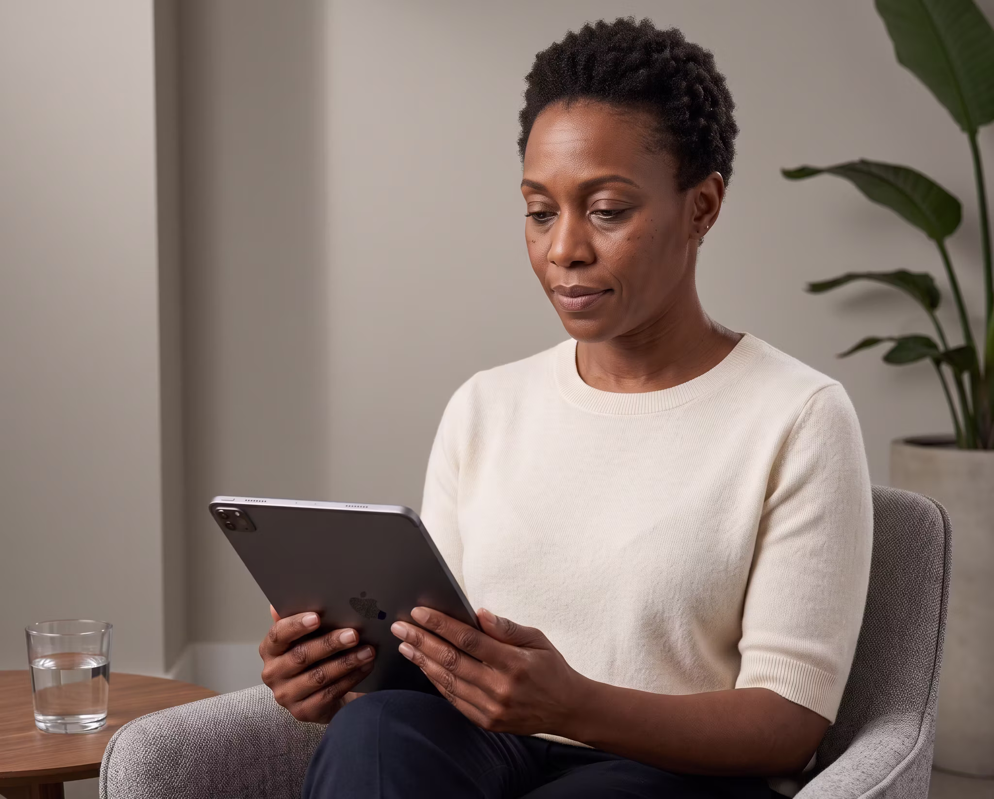 A woman reviewing a concept on a tablet